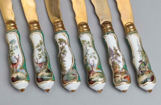 A cutlery set for six persons, decorated with hunting scenes and green-mosaic ground in its original leather case  | MasterArt